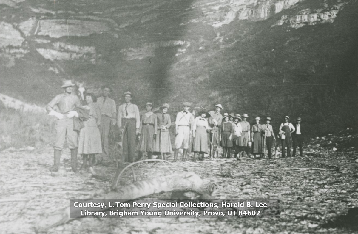 The hikers from the first group of students to hike to the summit of Timp line up in this black and white photograph.