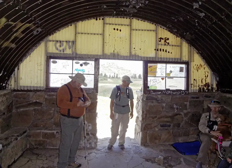 People standing in the door way of the shelter