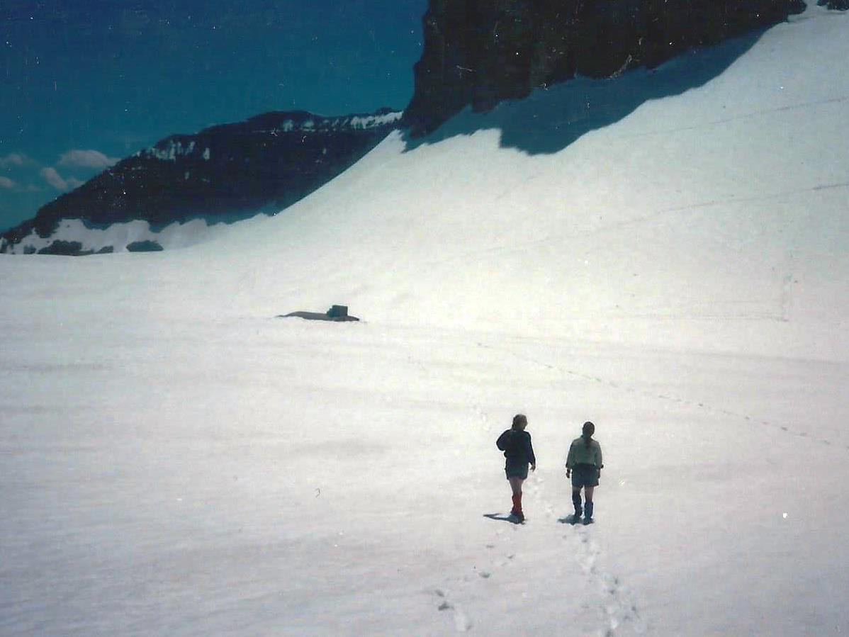 Two members of TERT are shown walking on deep snow